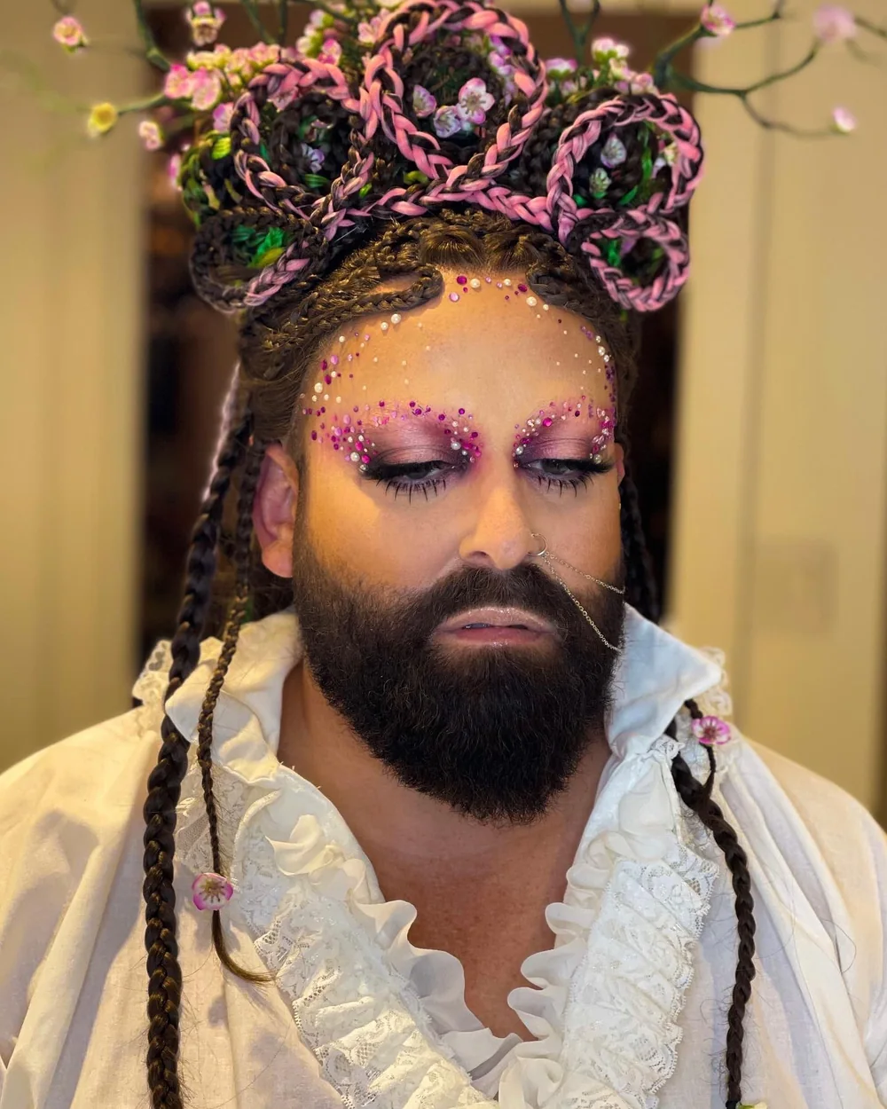 Baroque character with a jewelled floral crown and glitter brows