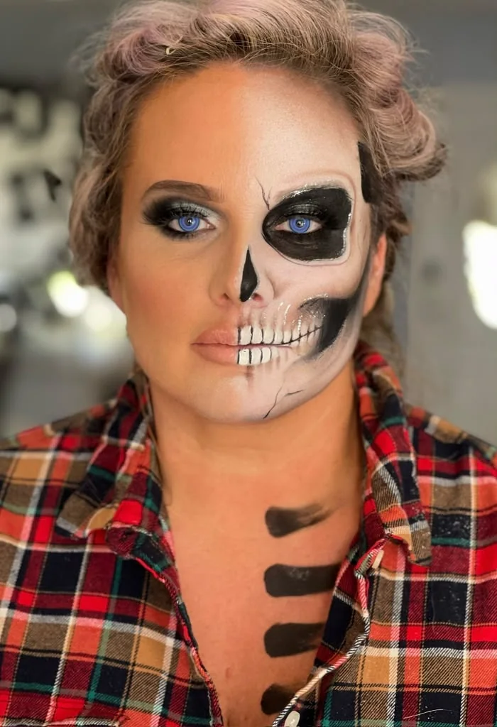 Black and white half skull with painted neck detail
