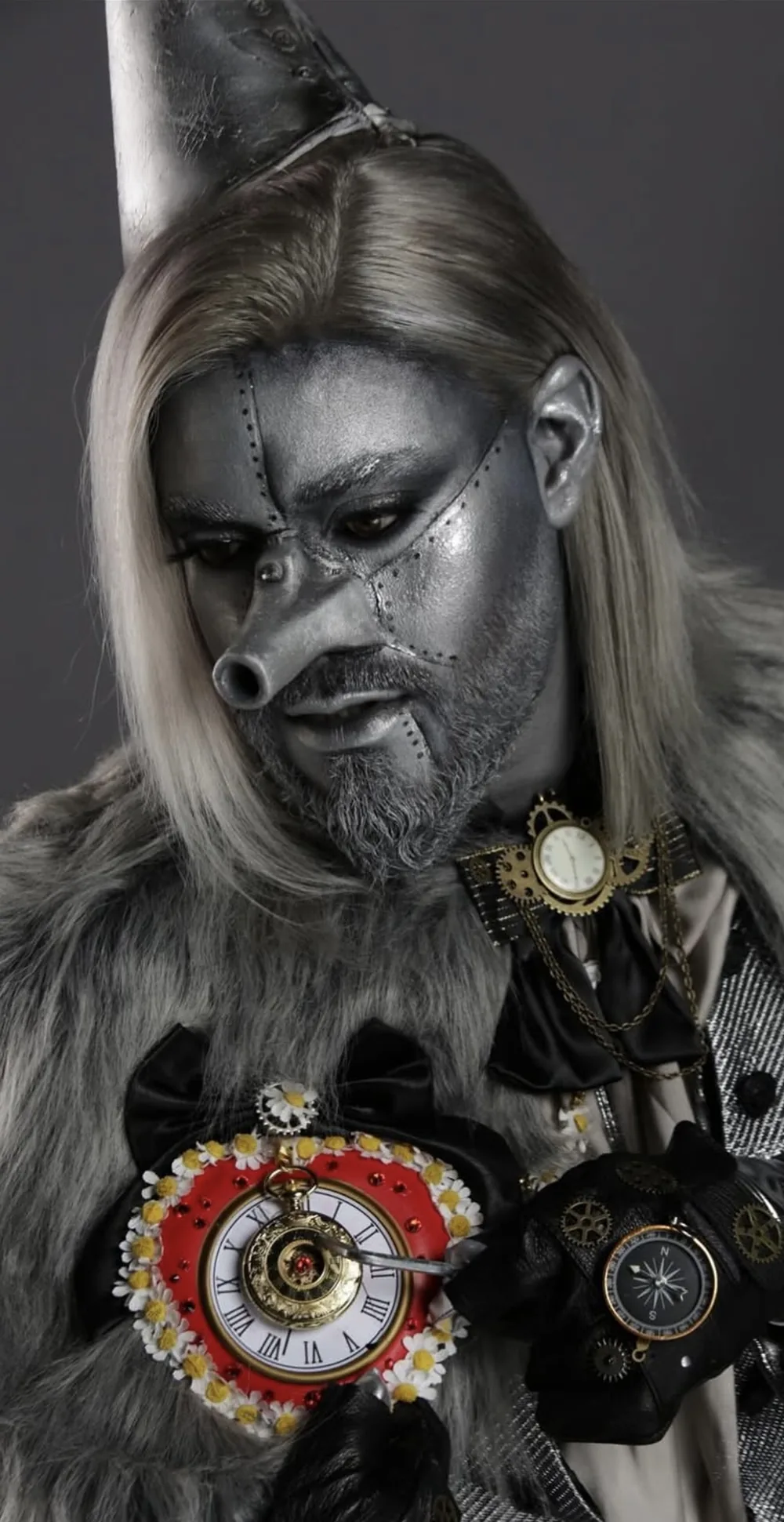 Silver steampunk character with metallic skin and monocle