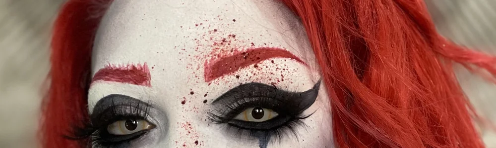 Dramatic Halloween eye makeup with graphic liner and blood detail